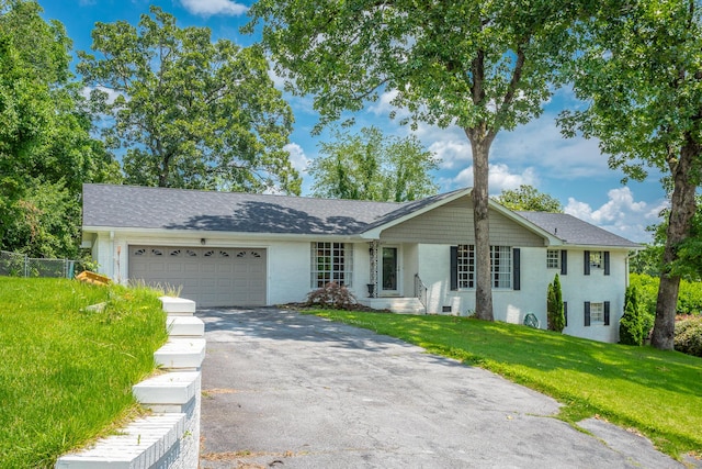 409 Caraway Turn, Chattanooga, TN 37415 - ranch-style house featuring asphalt driveway, a garage, brick siding, and a shingled roof
