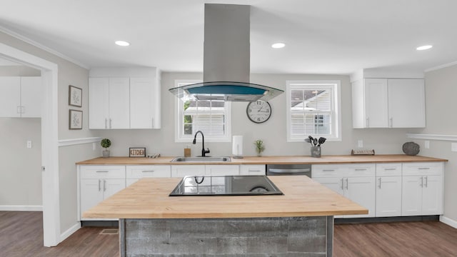 1514 Prigmore Rd, Chattanooga, TN 37412 - kitchen with wood counters, black electric cooktop, island range hood, dark wood-style flooring, and white cabinets