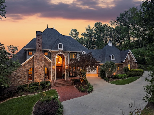 11606 Channel Front Ct, Soddy Daisy, TN 37379 - french country inspired facade with a chimney, stone siding, and curved driveway