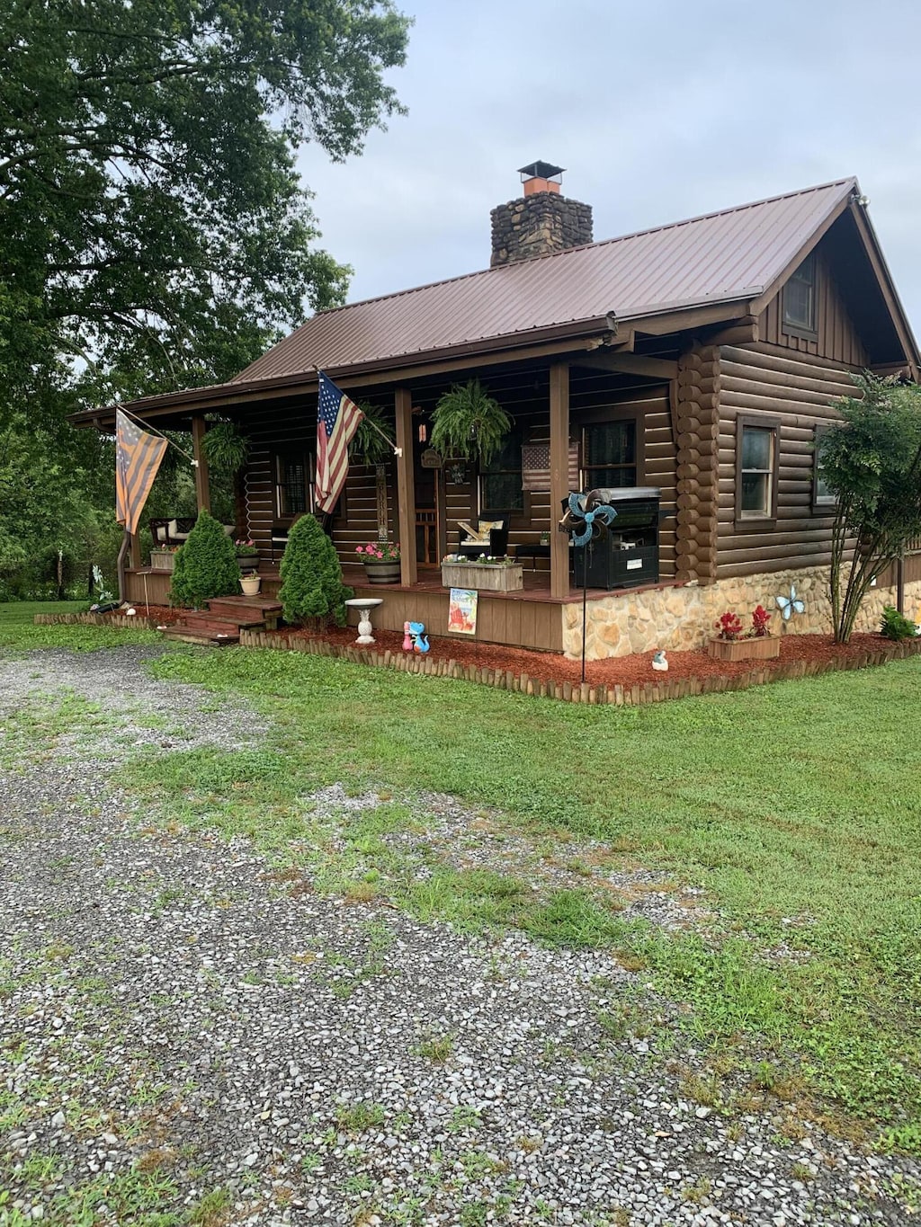 2538 Lead Mine Valley Rd SW, Cleveland, TN 37311 - back of house featuring covered porch, a chimney, a metal roof, and a lawn