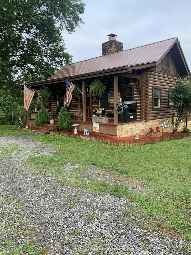 2538 Lead Mine Valley Rd SW, Cleveland, TN 37311 - back of house featuring covered porch, a chimney, a metal roof, and a lawn