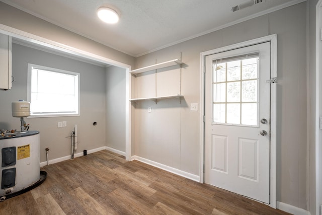 594 Prater Rd, Rossville, GA 30741 - laundry area with electric water heater, plenty of natural light, wood finished floors, hookup for an electric dryer, and crown molding