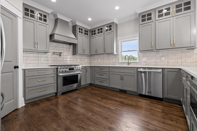 1784 River Breeze Dr, Soddy Daisy, TN 37379 - kitchen with appliances with stainless steel finishes, wall chimney range hood, gray cabinets, dark wood-type flooring, and backsplash