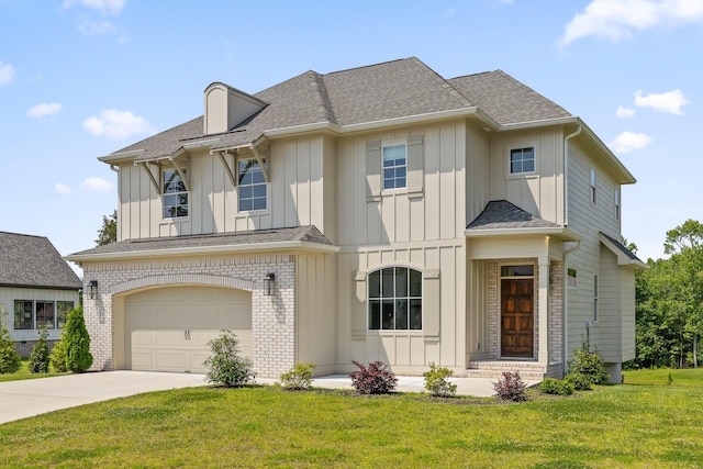 1784 River Breeze Dr, Soddy Daisy, TN 37379 - view of front of property featuring board and batten siding, concrete driveway, a garage, roof with shingles, and a front lawn