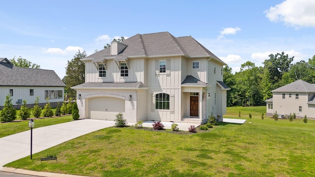 1784 River Breeze Dr, Soddy Daisy, TN 37379 - view of front facade with board and batten siding, concrete driveway, a front yard, and a garage