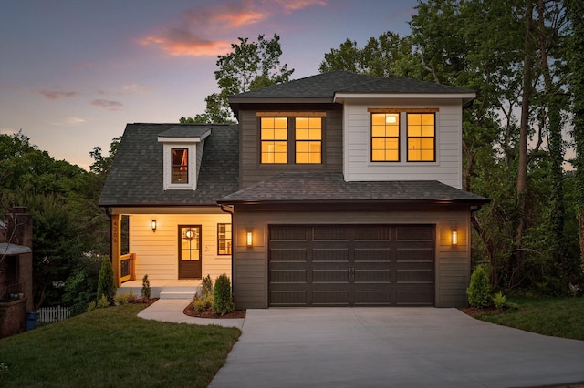 4206 Oakland Ter N, Red Bank, TN 37415 - view of front of home with concrete driveway, a garage, a shingled roof, a yard, and a porch