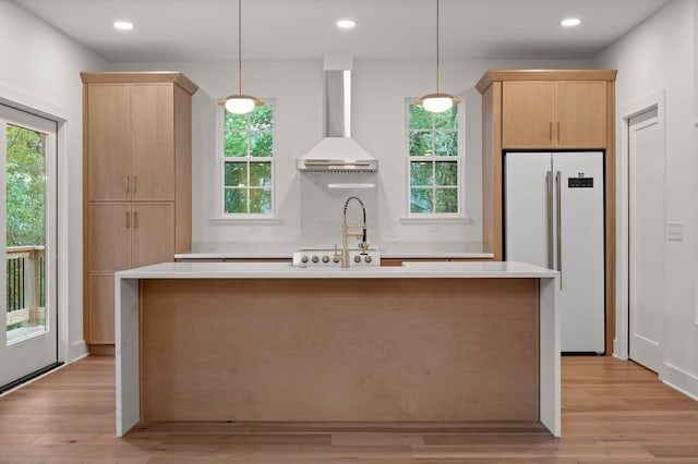 4206 Oakland Ter N, Red Bank, TN 37415 - kitchen with white fridge, wall chimney exhaust hood, light brown cabinets, light countertops, and recessed lighting