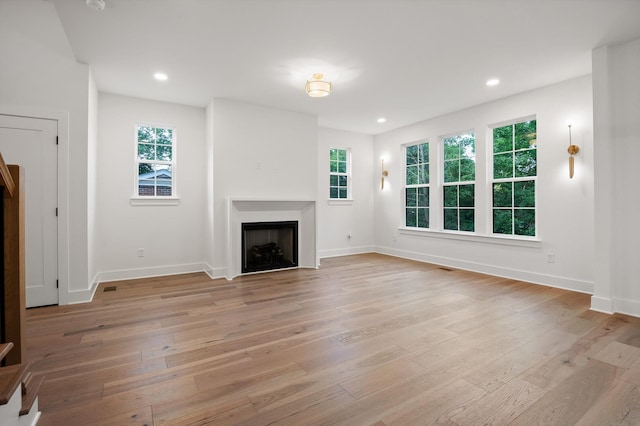4206 Oakland Ter N, Red Bank, TN 37415 - unfurnished living room with light wood finished floors, a fireplace, and recessed lighting