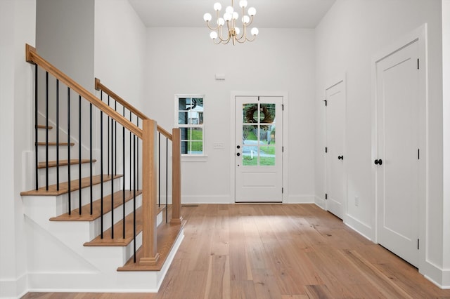 4206 Oakland Ter N, Red Bank, TN 37415 - foyer entrance with light wood-style flooring, a chandelier, and stairway
