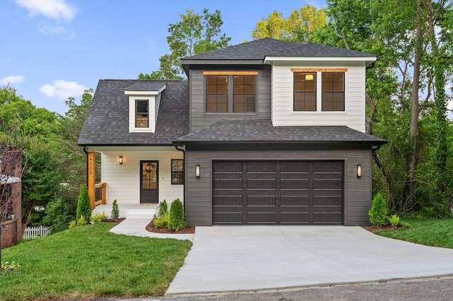 4206 Oakland Ter N, Red Bank, TN 37415 - view of front of home featuring a garage, concrete driveway, a front yard, covered porch, and roof with shingles