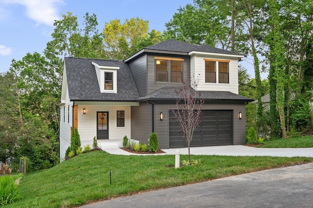 4206 Oakland Ter N, Red Bank, TN 37415 - view of front facade featuring a garage, a front yard, driveway, roof with shingles, and a porch