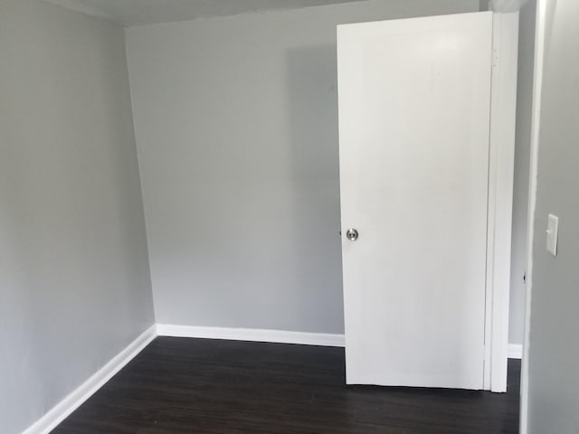 5007 Jarrett Rd, Chattanooga, TN 37416 - unfurnished room with baseboards and dark wood-type flooring