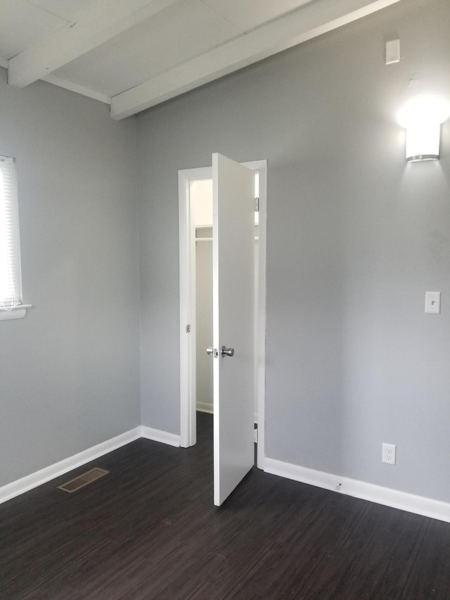 5007 Jarrett Rd, Chattanooga, TN 37416 - empty room featuring dark wood finished floors and beam ceiling