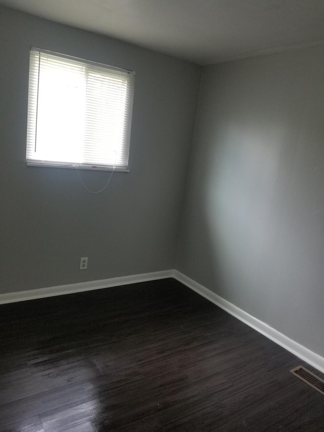 5007 Jarrett Rd, Chattanooga, TN 37416 - unfurnished room featuring dark wood-style floors and baseboards