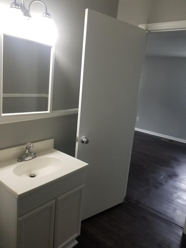 5007 Jarrett Rd, Chattanooga, TN 37416 - bathroom featuring vanity and wood finished floors