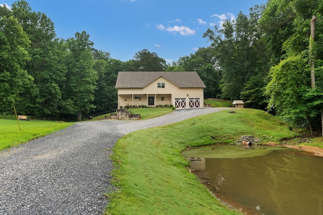 210 Gordon Dr, Chatsworth, GA 30705 - view of front facade featuring driveway, a front yard, and a view of trees