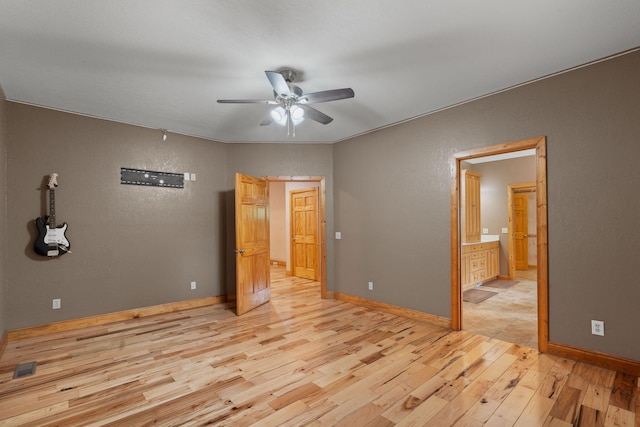 210 Gordon Dr, Chatsworth, GA 30705 - unfurnished bedroom featuring light wood-style floors, ceiling fan, and connected bathroom
