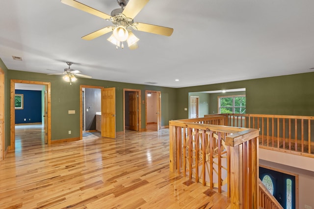 210 Gordon Dr, Chatsworth, GA 30705 - empty room with a ceiling fan and light wood finished floors