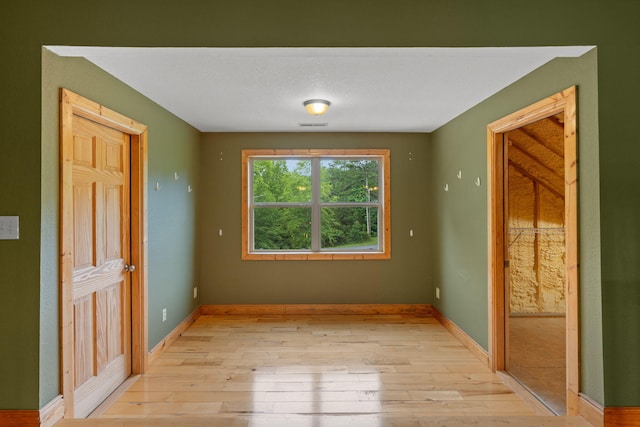 210 Gordon Dr, Chatsworth, GA 30705 - spare room featuring light wood finished floors and baseboards