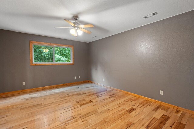 210 Gordon Dr, Chatsworth, GA 30705 - empty room with ceiling fan and wood finished floors
