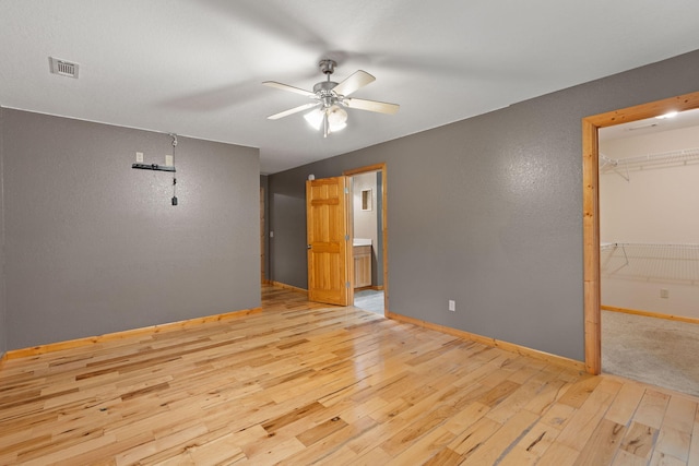 210 Gordon Dr, Chatsworth, GA 30705 - unfurnished room with ceiling fan, light wood-style floors, and a textured wall