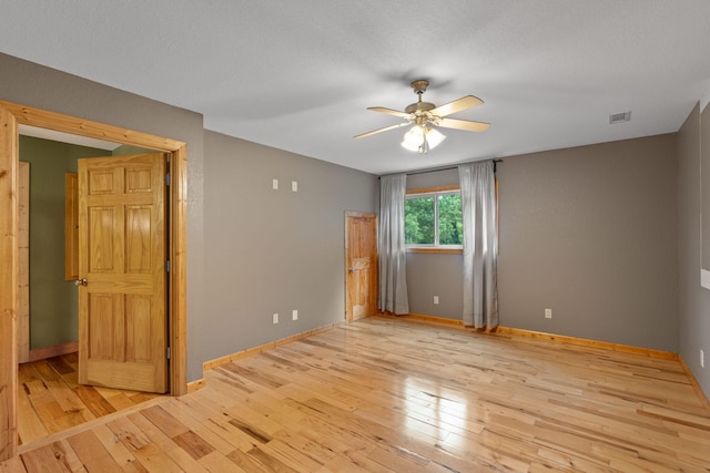210 Gordon Dr, Chatsworth, GA 30705 - empty room with a ceiling fan and hardwood / wood-style flooring