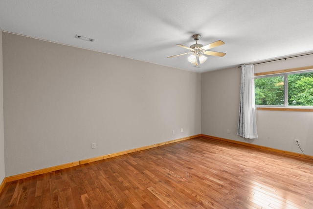 210 Gordon Dr, Chatsworth, GA 30705 - empty room featuring a ceiling fan and light wood finished floors