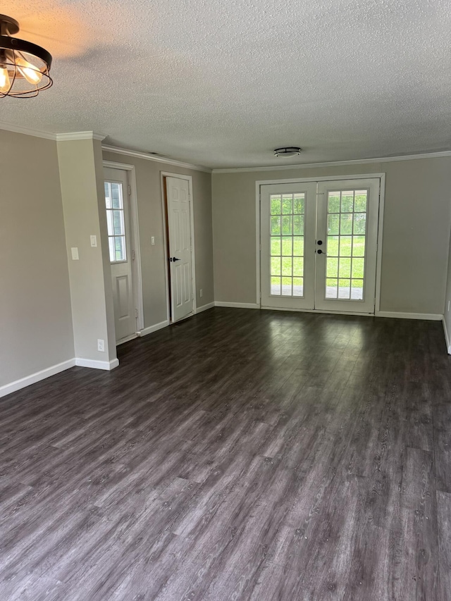 115 Palm Beach Ave, Rossville, GA 30741 - unfurnished living room with a textured ceiling, ornamental molding, french doors, and dark wood-style floors