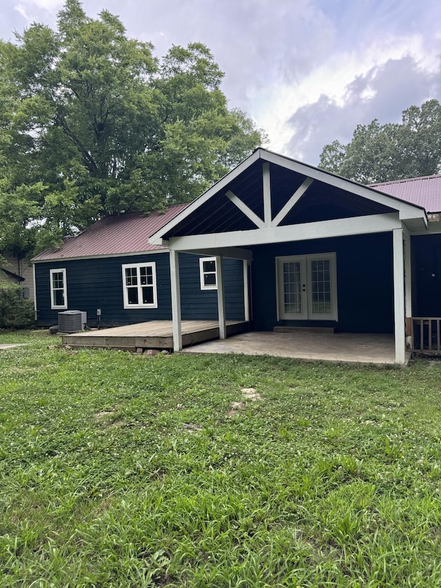 115 Palm Beach Ave, Rossville, GA 30741 - rear view of property with french doors, a metal roof, a yard, and a patio area