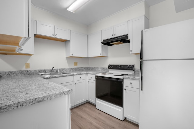 900 Mountain Creek Rd Unit E66, Chattanooga, TN 37405 - kitchen featuring freestanding refrigerator, electric range, under cabinet range hood, light wood-style flooring, and white cabinets