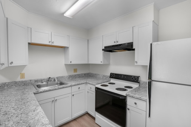 900 Mountain Creek Rd Unit E66, Chattanooga, TN 37405 - kitchen with white appliances, under cabinet range hood, white cabinets, and light countertops