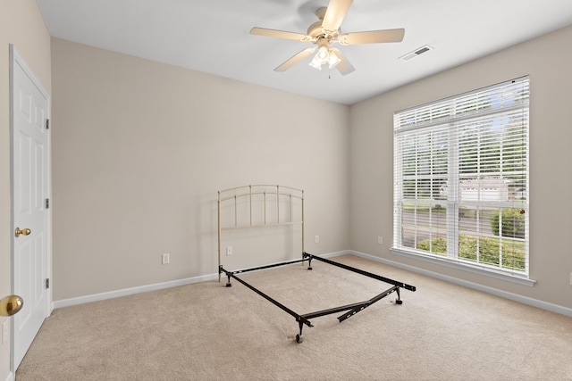 6276 Amber Brook Dr, Hixson, TN 37343 - unfurnished bedroom featuring carpet floors, multiple windows, and a ceiling fan