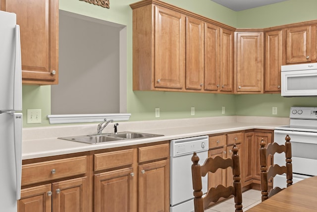 6276 Amber Brook Dr, Hixson, TN 37343 - kitchen featuring white appliances, light countertops, tile patterned flooring, and brown cabinetry