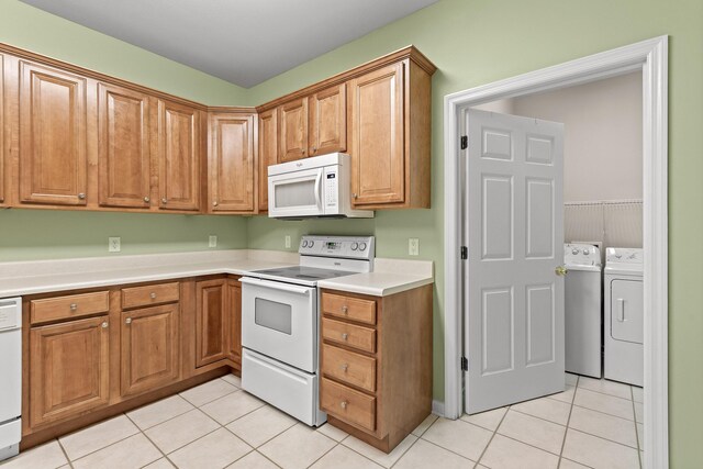 6276 Amber Brook Dr, Hixson, TN 37343 - kitchen with white appliances, washer and dryer, light tile patterned floors, and light countertops