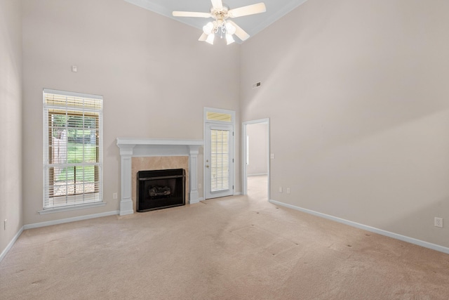 6276 Amber Brook Dr, Hixson, TN 37343 - unfurnished living room featuring light carpet, a tile fireplace, a high ceiling, a ceiling fan, and crown molding