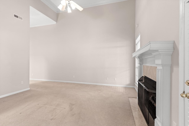 6276 Amber Brook Dr, Hixson, TN 37343 - unfurnished living room with light carpet, ceiling fan, ornamental molding, a high end fireplace, and a high ceiling