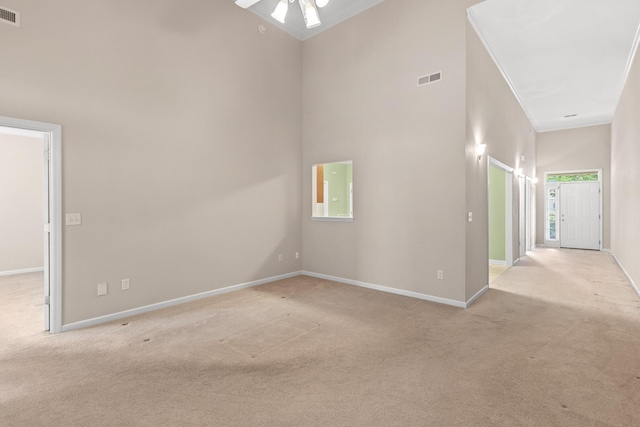 6276 Amber Brook Dr, Hixson, TN 37343 - empty room featuring light colored carpet, crown molding, and a high ceiling