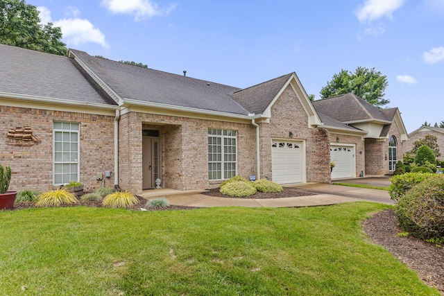 6276 Amber Brook Dr, Hixson, TN 37343 - view of front of house featuring driveway, an attached garage, a front lawn, a shingled roof, and brick siding