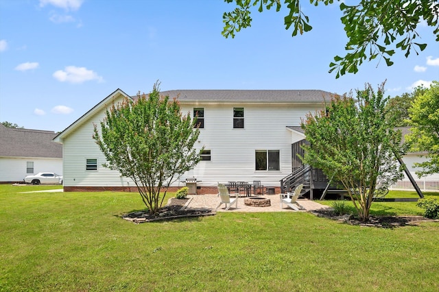 7470 Jester Ct, Ooltewah, TN 37363 - back of property with an outdoor fire pit, a yard, a patio, and crawl space