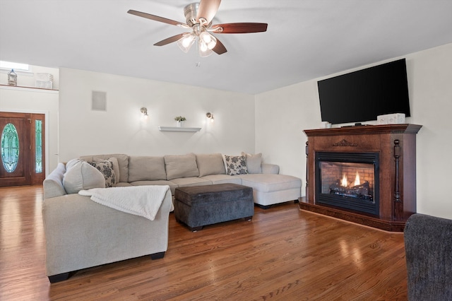 7470 Jester Ct, Ooltewah, TN 37363 - living room with ceiling fan, wood finished floors, and a warm lit fireplace