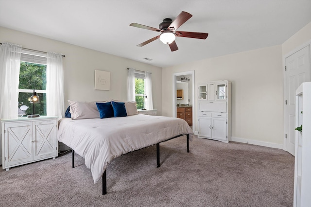 7470 Jester Ct, Ooltewah, TN 37363 - bedroom with light colored carpet, a ceiling fan, and ensuite bathroom