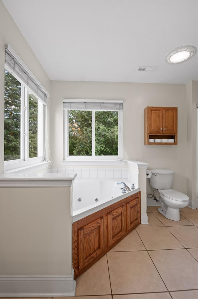 7470 Jester Ct, Ooltewah, TN 37363 - bathroom with a tub with jets and tile patterned floors