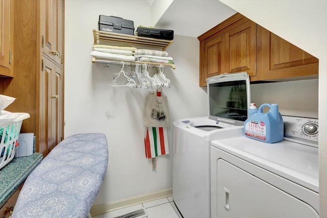 5 Woodland Way, Chattanooga, TN 37419 - laundry room with washing machine and dryer, cabinet space, and light tile patterned floors