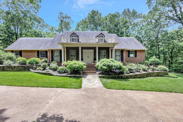 5 Woodland Way, Chattanooga, TN 37419 - cape cod home with brick siding, a front yard, and covered porch