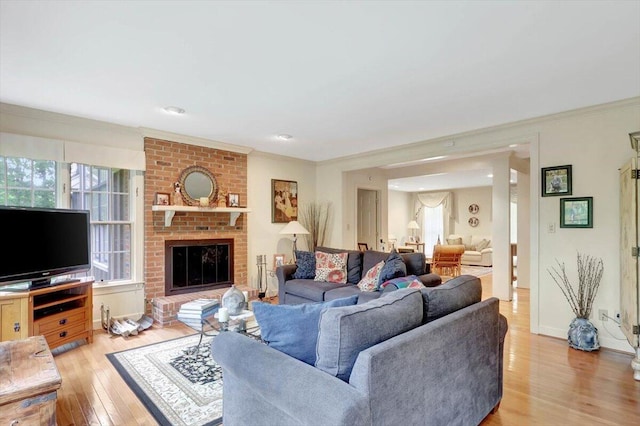 5 Woodland Way, Chattanooga, TN 37419 - living area featuring light wood finished floors, ornamental molding, and a brick fireplace