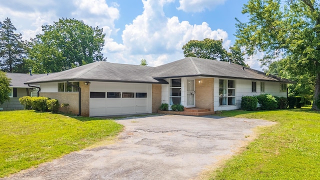 4412 Live Oak Ln, Chattanooga, TN 37411 - single story home with driveway, an attached garage, brick siding, and a front lawn