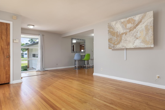 4412 Live Oak Ln, Chattanooga, TN 37411 - unfurnished living room with light wood-type flooring and baseboards