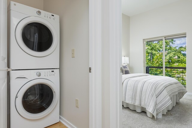 844 E 8th St, Chattanooga, TN 37403 - washroom with stacked washer and clothes dryer and light carpet