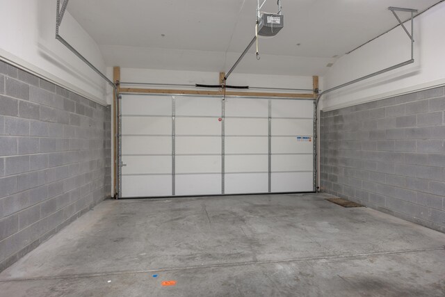 844 E 8th St, Chattanooga, TN 37403 - garage with a garage door opener and concrete block wall
