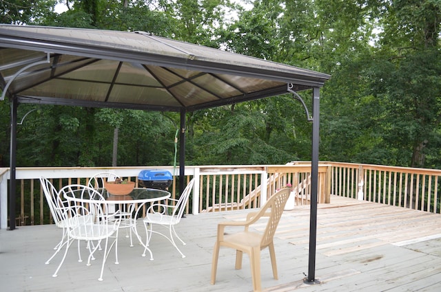8211 Troubadour Way, Ooltewah, TN 37363 - wooden deck featuring a gazebo, view of scattered trees, and outdoor dining area